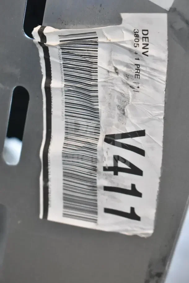 A barcode and label on a Cooking Performance Group Commercial Single Burner Stock Pot Range, marked as scratch and dent.