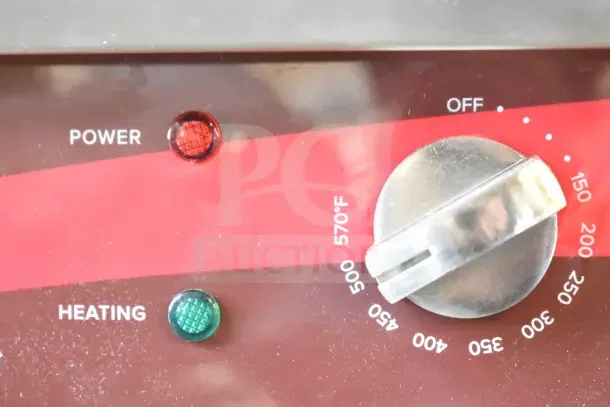 Close-up of Avantco EG24N griddle control panel showing power and heating indicators, with temperature dial up to 570°F.