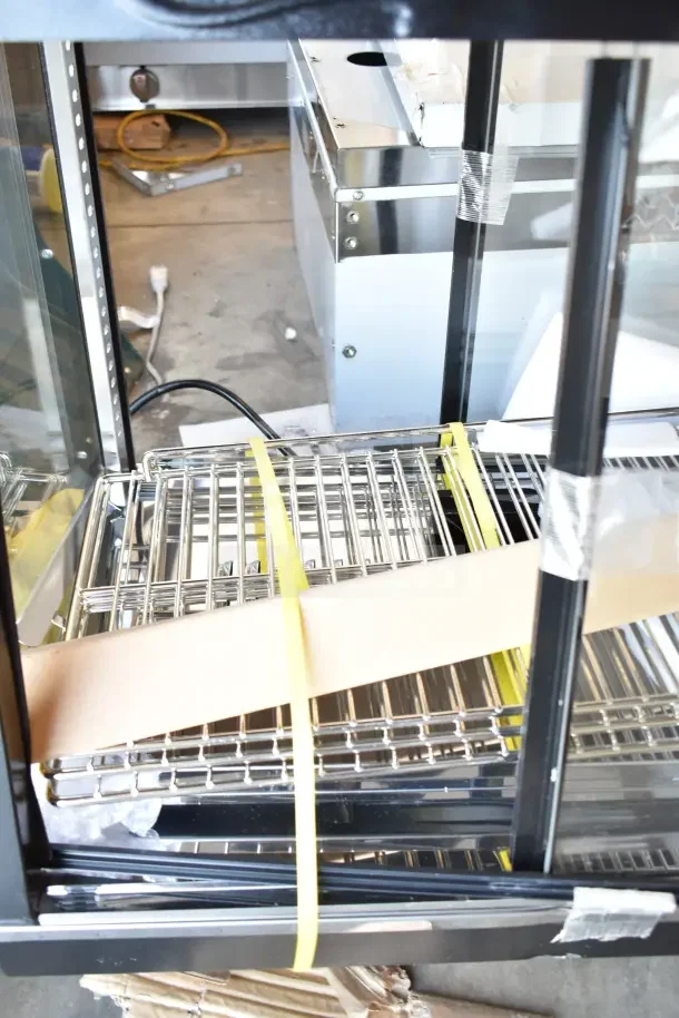 Brand new Avantco 177HDC26 heated display case, 26", 3 shelves, sliding doors, self/full service, 120 volts, scratch and dent.