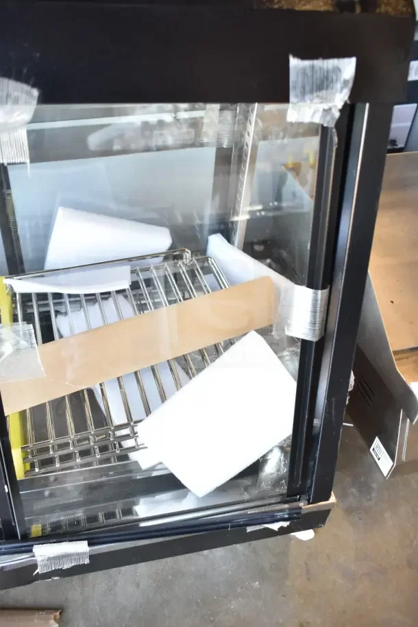 Brand new Avantco 177HDC26 26" heated display case, 3 shelves, sliding doors, minor scratches and dents, 120V, 1 phase.