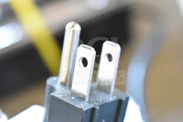 Close-up of a plug for the Avantco 177HDC26 Heated Display Case, indicating a 120 Volts, 1 Phase power requirement.