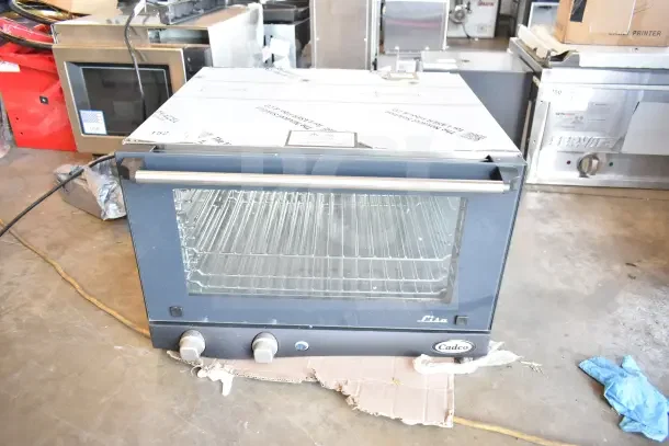 Brand new 2026 Cadco Lisa OV-013 convection oven, 3-shelf, half size, 120 volts, manual controls, scratch and dent condition.