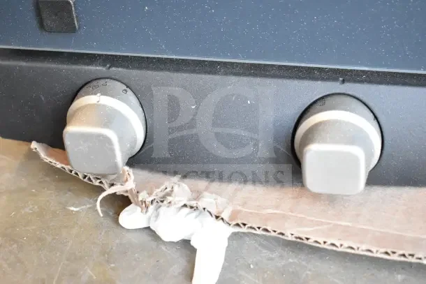 Cadco Lisa OV-013 convection oven knobs, showing scratch and dent condition. Manual controls, 3-shelf design. 120V, 1 Phase.