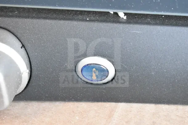 Brand new Cadco Lisa OV-013 3-shelf countertop convection oven. Minor cosmetic damage; temperature control knob visible.