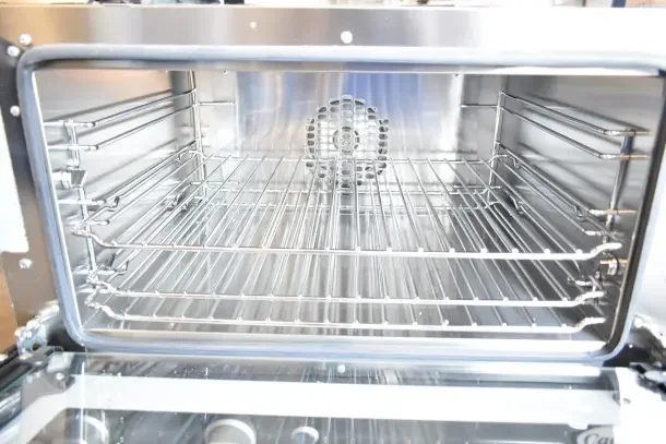 Brand new Cadco Lisa OV-013 3-shelf medium-duty countertop convection oven, 120V, minor cosmetic dents, stainless interior.