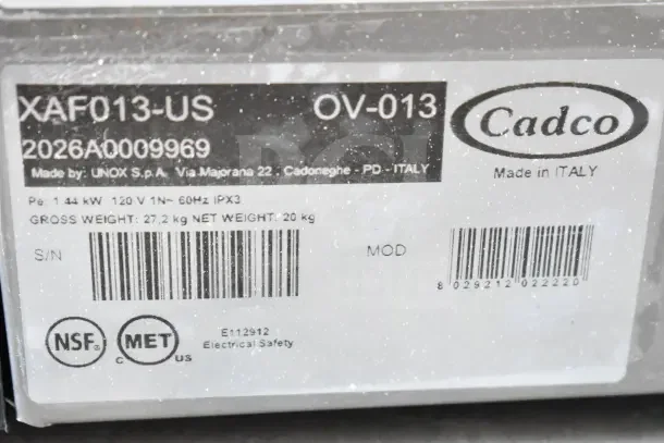 Brand new 2026 Cadco Lisa OV-013 convection oven. 3-shelf, half size, medium-duty, manual. 120V. Labels show specs and serial.