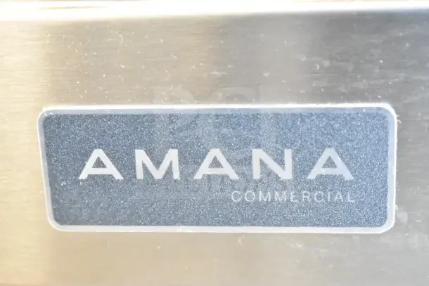 Amana RC17S2 Commercial Microwave, Stainless Steel, Push Button, New Scratch and Dent. Visible Amana logo label.