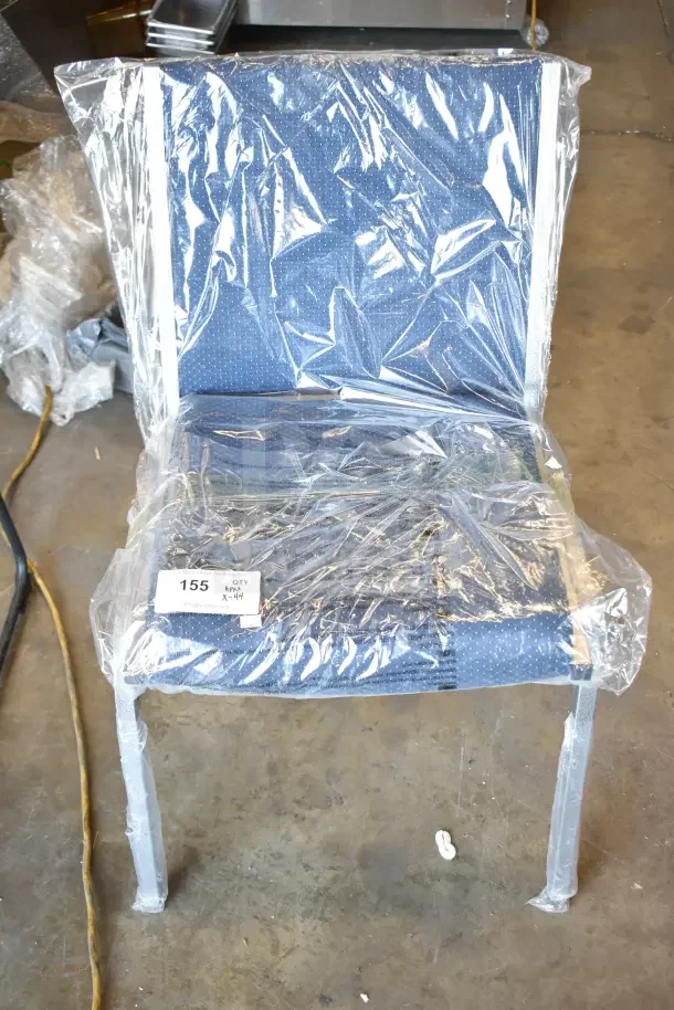 Brand new blue stackable banquet chair, wrapped, with scratch and dent condition. Quantity label: 155, QTY X-44.