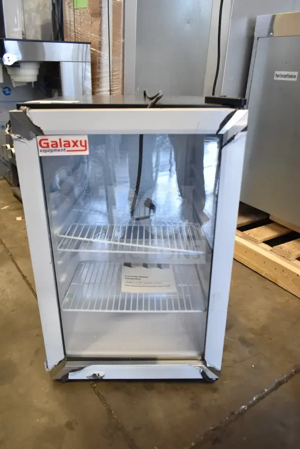 Brand new Galaxy 177CRG3B countertop refrigerated merchandiser, 2.5 cu ft, black, customizable, minor dents visible.