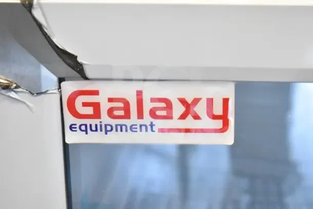 Brand new Galaxy 177CRG3B customizable countertop refrigerated merchandiser, 2.5 cu ft, 110-120V, with noticeable dent.