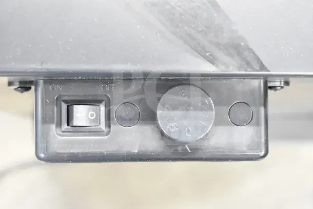 Close-up of the control panel for Galaxy 177CRG3B refrigerated merchandiser showing power switch and temperature dial.