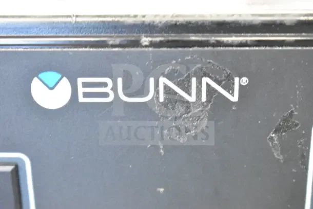 Brand logo "BUNN" on a scratch and dent 2025 Bunn TB3Q iced tea brewer, Model 36700.0013, 120V, 3-gallon capacity.