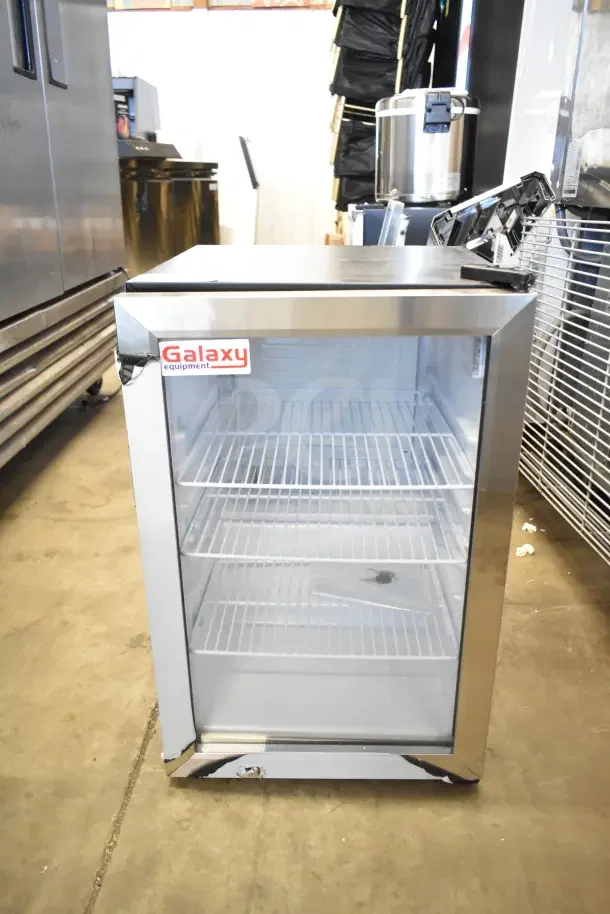 Brand new Galaxy 177CRG3B black customizable countertop refrigerated merchandiser, 2.5 cu ft, with minor scratches and dents.