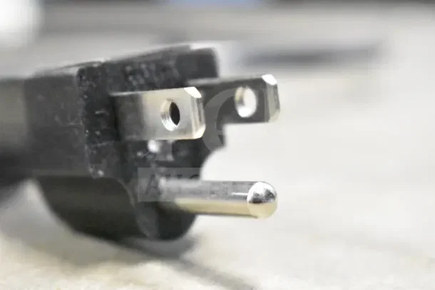 Close-up view of a standard three-prong plug for the Galaxy 177CRG3B countertop display refrigerated merchandiser.
