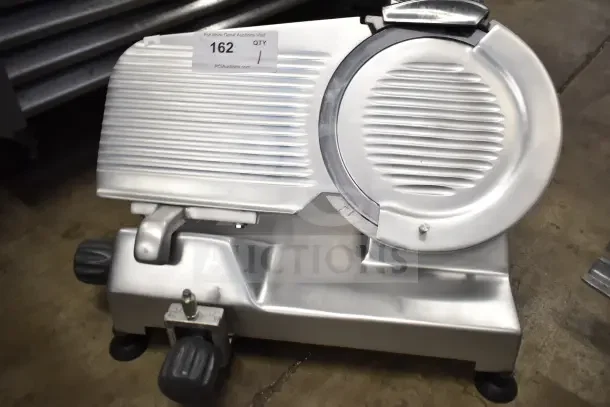 BRAND NEW Hobart EDGE10-11 10" meat slicer with blade sharpener. 2022 model, 115V, 1 phase. Includes visible auction tag.