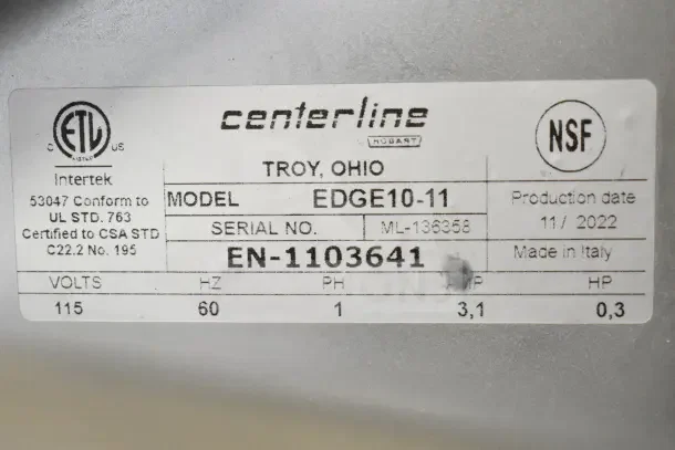 Alt text: "Label on 2022 Hobart Centerline EDGE10-11 Manual Meat Slicer. Shows model number, serial number, and certifications."