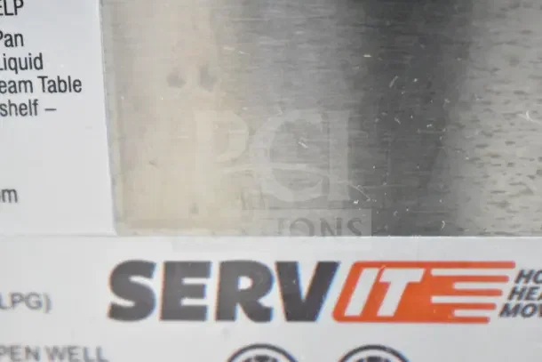 "Brand new ServIt 423GST2WELP steam table, scratches visible, 7000 BTU, liquid propane, two-pan open well, undershelf included."