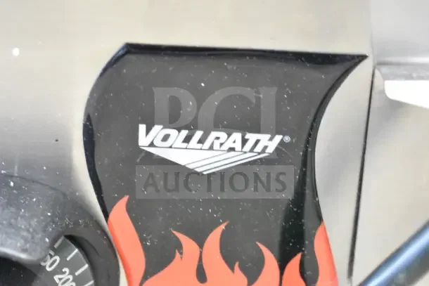BRAND NEW Vollrath 14" Electric Countertop Grill, model FTA 7016 40715, with minor scratches. 120 Volts, 1 Phase.