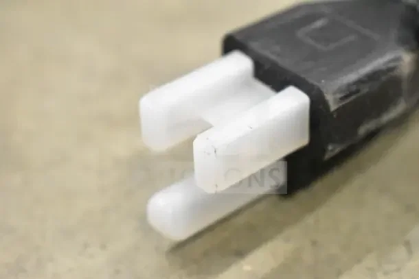Close-up of a power plug for a Vollrath FTA 7016 40715 Cayenne 14" electric countertop grill, 120V, 1 phase.