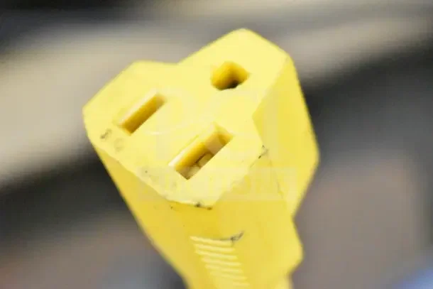 Yellow power plug with black smudges, part of a Lavex Pro 978LPS20BDC burnisher, 1500 RPM, scratch and dent condition.