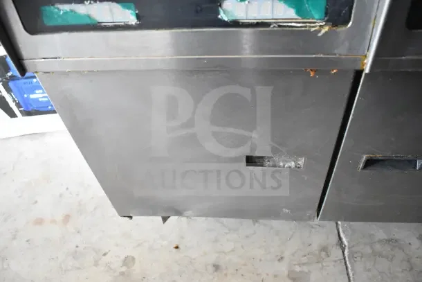 Pitco Frialator commercial gas-powered 2-bay deep fat fryer on casters, stainless steel, some wear visible.