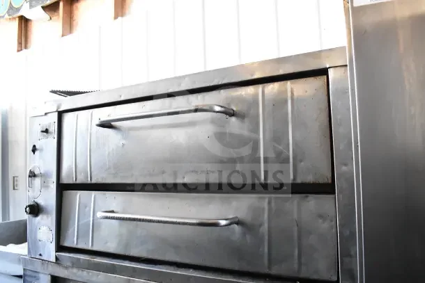 Bakers Pride commercial gas pizza oven on metal legs, single deck, stainless steel, gently used condition.