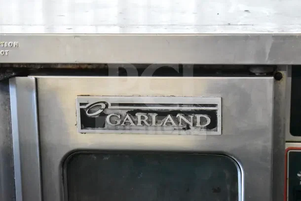 Garland Master 200 commercial convection oven, gas-powered, view-through doors, thermostatic controls, visible Garland logo.