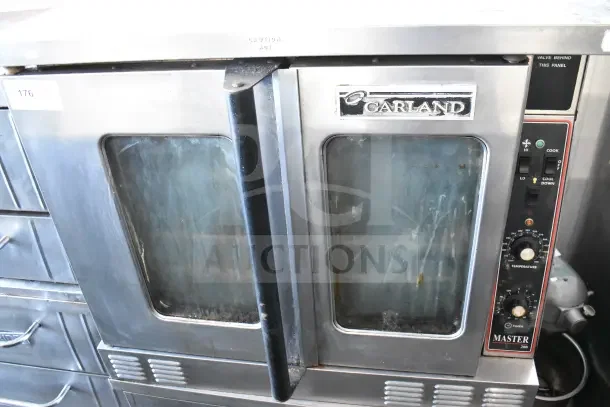 Garland Master 200 commercial gas convection oven with view-through doors and thermostatic controls. Signs of wear visible.