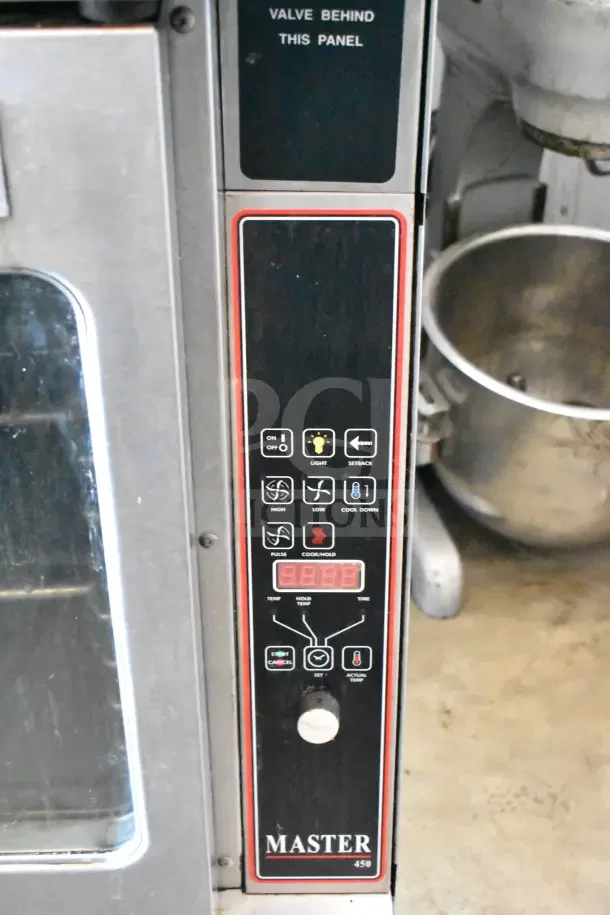 2 Garland Master 200 commercial gas convection ovens, view-through doors, thermostatic controls, stainless finish, used.