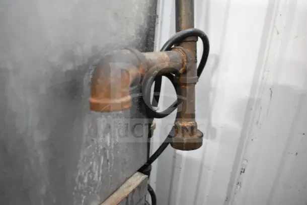 Close-up of rusted pipe and cables on Garland Master 200 Convection Oven, indicating wear and need for attention.
