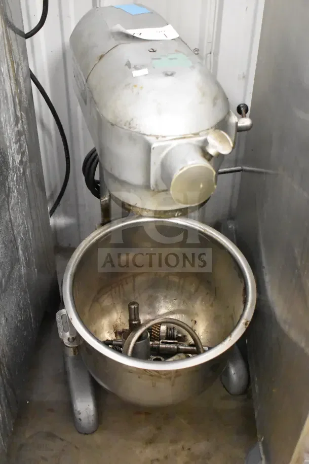 Hobart A200 commercial mixer, 20-quart capacity, with mixing bowl. Good used condition, 115V, 1-phase. Visible marks and attachments.