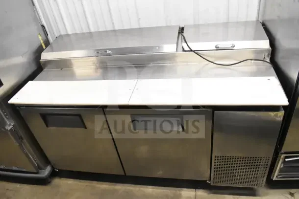 True TPP-67 commercial pizza prep table on casters, stainless steel, 115 volts, 1 phase, dual doors, refrigerated unit.