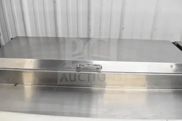 True TPP-67 commercial pizza prep table, stainless steel, excellent condition, on commercial casters, 115V, 1 Phase.