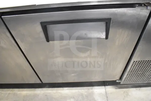 True TPP-67 commercial pizza prep table, stainless steel, with durable commercial casters, 115 volts, 1 phase.