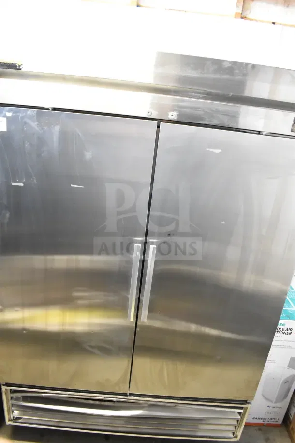 True TS-49 commercial reach-in cooler, 2 doors, stainless steel, on casters, 115 volts, 1 phase, good condition.