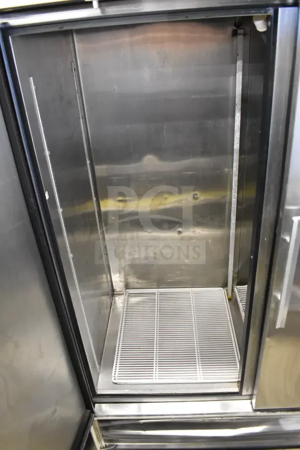 True TS-49 Commercial 2 Door Reach-In Cooler, stainless steel, on casters, interior view, 115V, 1 Phase.