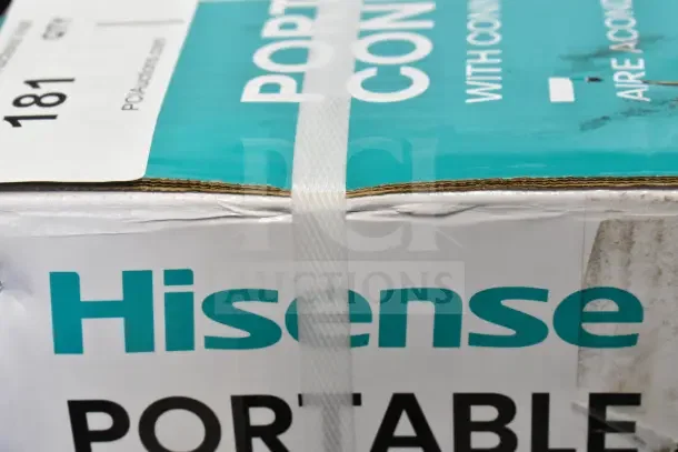 Brand new Hisense Portable Air Conditioner box with visible scratches and dents. Model label "181" on top.