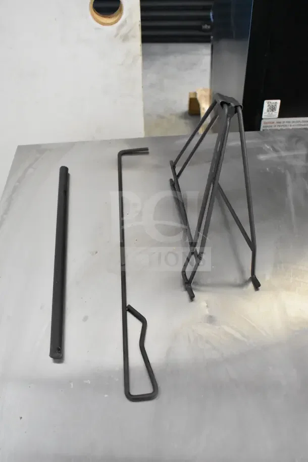 Brand new Bighorn 24" Mini Ranch Fire Pit, disassembled. Includes metal stand, pole, and poker. Scratch and dent condition.