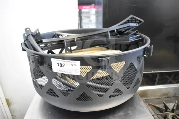 BRAND NEW Bighorn SRFP9624 24" Mini Ranch Fire Pit, scratch and dent, metal frame, mesh sides, auction tag visible.