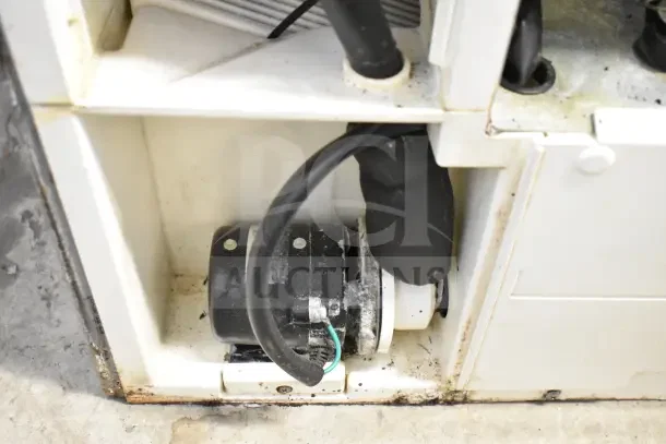 Hoshizaki KM-350MAJ ice machine, internal view showing motor and wiring. Condition shows signs of use, 387lb capacity.