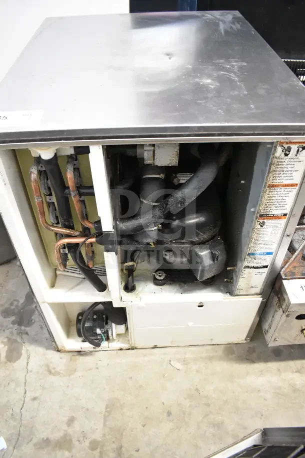 Hoshizaki KM-350MAJ ice machine head, 387lb capacity, commercial use, visible internal components, 115 volts, 1 phase unit.