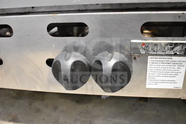 Vulcan commercial countertop gas-powered 6 burner range with control knobs and lighting instructions visible. Used condition.