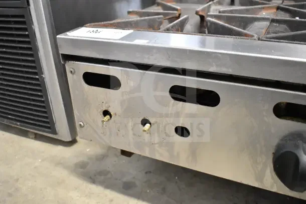 Vulcan Commercial 6 Burner Gas Range, stainless steel, countertop design, used condition, visible wear and rust on burners.