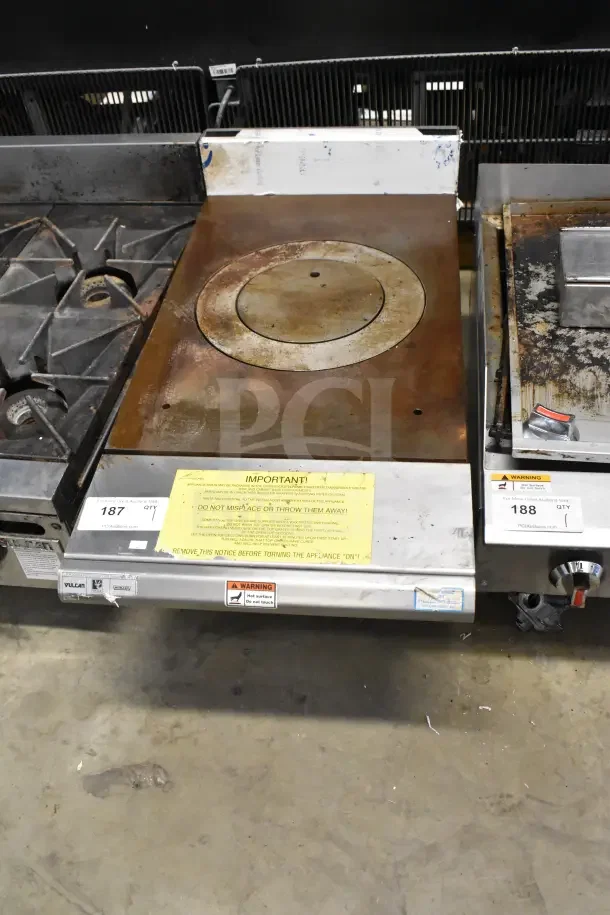 Vulcan Commercial Gas Single Burner Range, countertop model, rusted top, visible warning label, stainless base.
