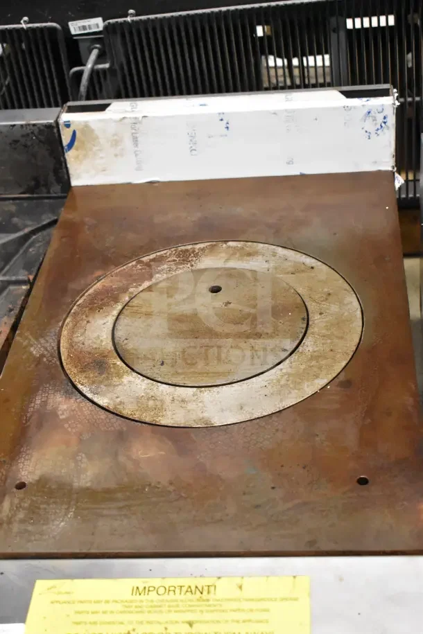 Vulcan Commercial Countertop Gas Burner with single burner, metallic surface, and visible wear. Important use notice included.