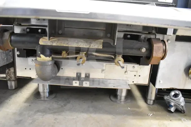 Vulcan Commercial Countertop Gas-Powered Single Burner Range, under-view showing connections and components, good condition.