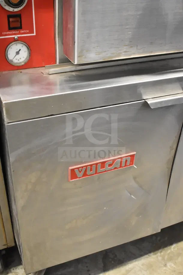 Vulcan VL2GPS commercial steam cabinet, natural gas, 2 decks, 170,000 BTU, visible wear, Vulcan logo, compartment switch.