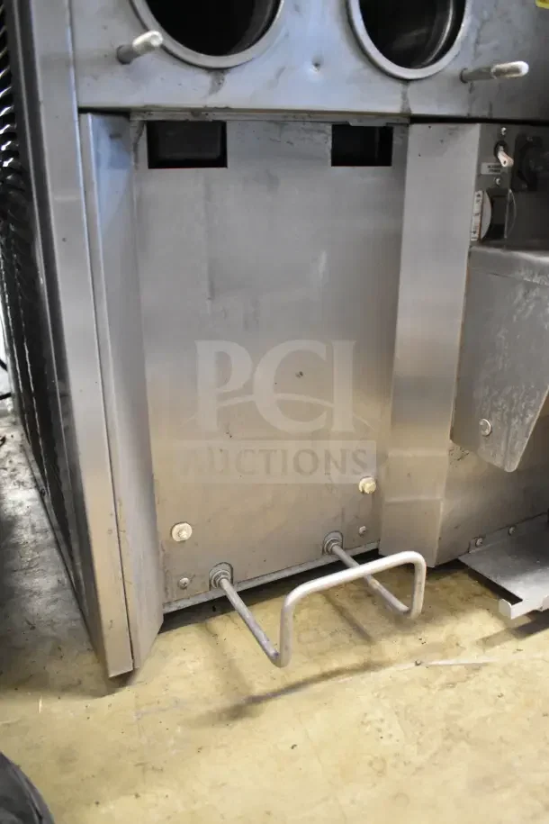 Stoelting commercial countertop soft serve machine, dual flavor with twist, 208/240V, visible metal structure, used.