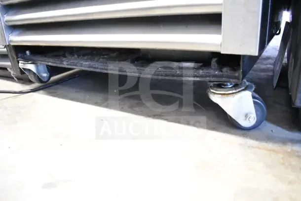 2017 True T-19F commercial freezer on casters, 115V, 1 Phase, shown from the base with visible caster wheels.