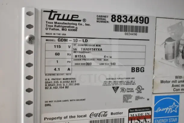 2016 True GDM-10-LD commercial cooler label showing model, voltage, phase, refrigerant, and Energy Star certification.